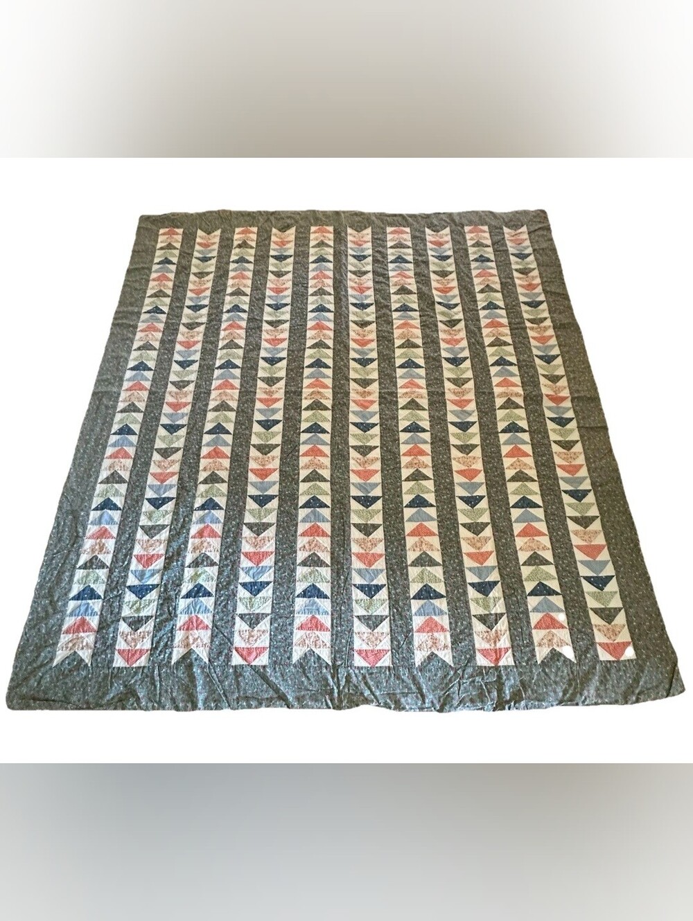 Vintage handmade flying geese quilt
